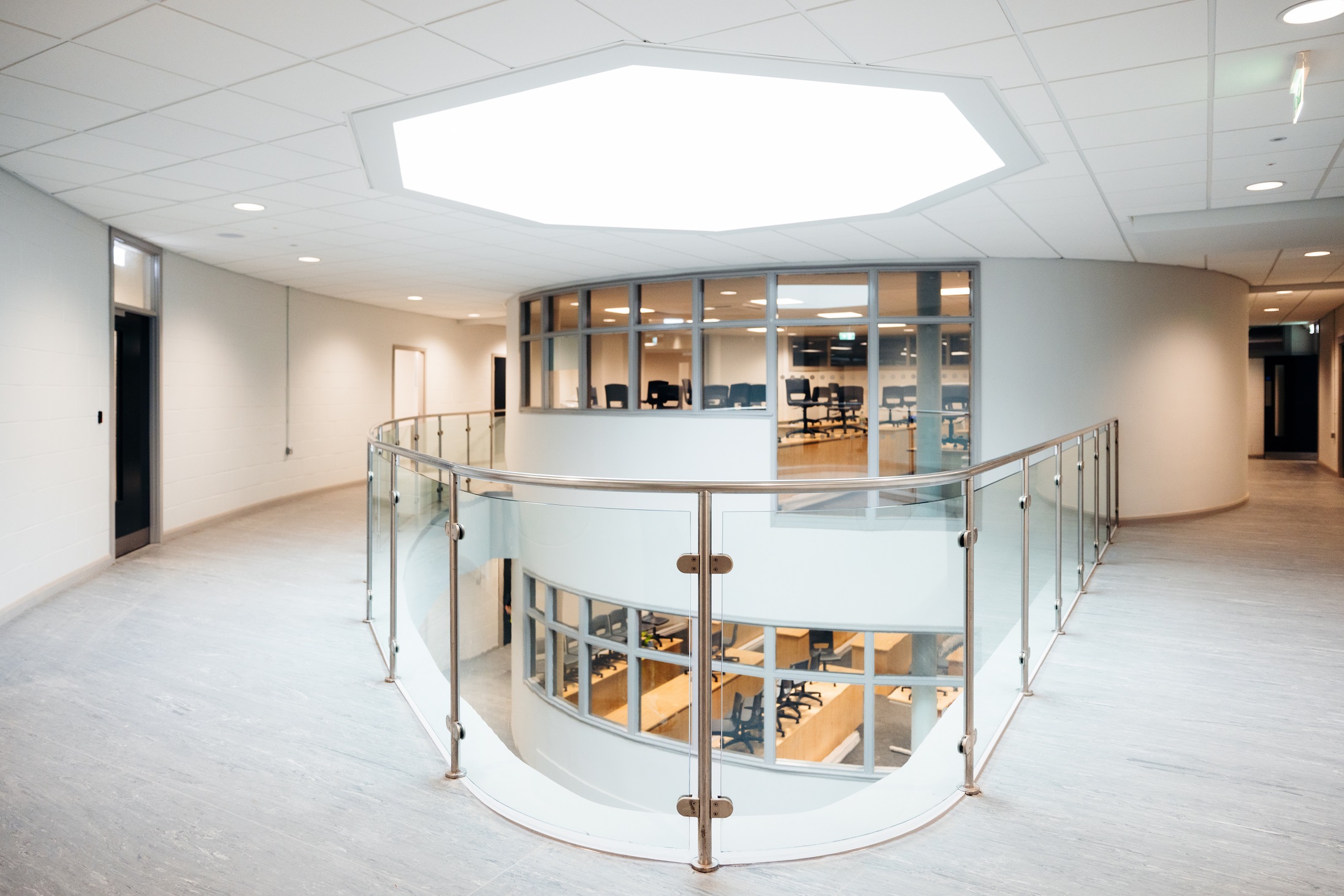 A light and bright corridor and mezzanine with glass barriers in Hull Trinity House Academy
